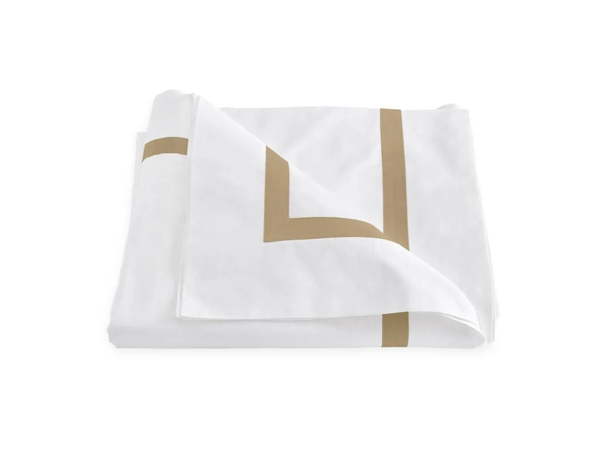 Lowell Champagne on White Bedding by Matouk